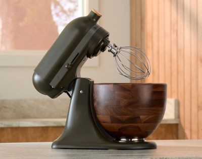 Trends in 2024 included putting style over substance, like this $700 KitchenAid mixer in a deep green shade and a matte finish with a bowl fashioned from walnut, which is a type of wood “notorious for absorbing odors,” and needs regular maintenance.  (Courtesy of KitchenAid)