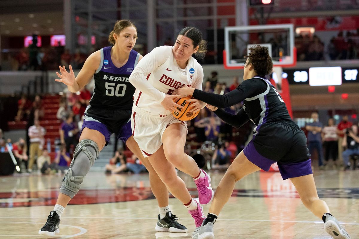 WSU guard Charlisse Leger-Walker, center, drives against Kansas State’s Ayoka Lee, left, and Brylee Glenn during an NCAA Tournament first-round game Saturday.  (Associated Press)
