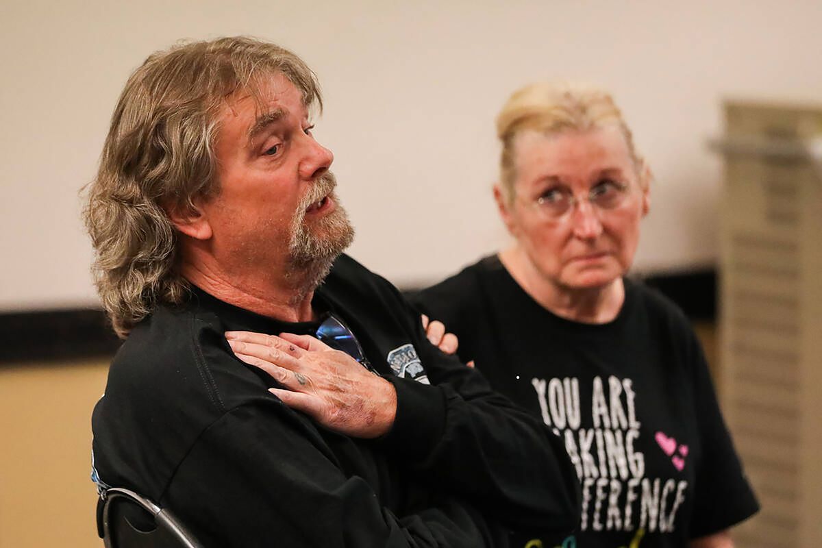 Scott Bunn is comforted by his wife Debra Bunn as he shares about medical conditions that have been attributed to different forms of radiation, at a downwinders information session hosted by the Nevada Radiation Exposure Screening and Education Program on Saturday, July 8, 2023, in Las Vegas.    (Daniel Pearson/Las Vegas Review-Journal/TNS)