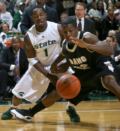 Idaho’s Kashif Watson and MSU’s Kalin Lucas chase the ball during first-half action on Sunday.   (Associated Press / The Spokesman-Review)
