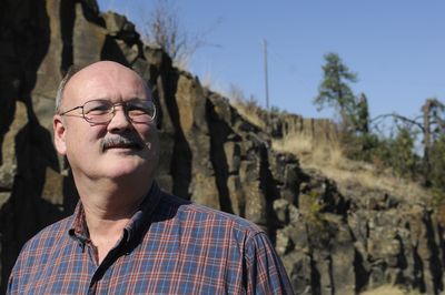 Cheney author John Soennichsen, standing in front of exposed columnar basalt on Sunset Hill, presents J. Harlen Bretz’s theorys on local scabland creation in his latest book, “Bretz’s Flood.”  (Jesse Tinsley / The Spokesman-Review)
