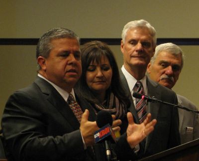 Idaho schools chief Tom Luna, left, announces that he won't seek re-election. Also pictured are Luna's wife Cindy, Senate President Pro-Tem Brent Hill, and Senate Education Chairman John Goedde. (Betsy Russell)