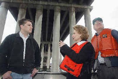 Gov. Christine Gregoire talks with Patrick T. Clarke, floating bridge design manager, as she tours the State Route 520 bridge Tuesday. With them is Secretary of Transportation Doug MacDonald, right. 
 (Associated Press / The Spokesman-Review)