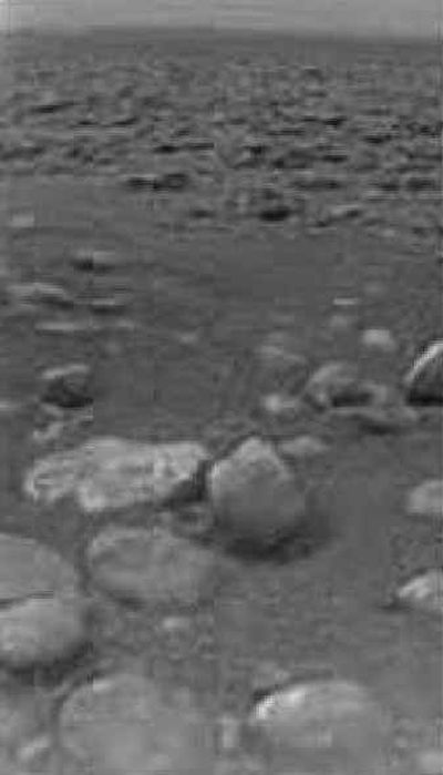
This European Space Agency image shows the surface of Saturn's moon Titan with ice blocks strewn around. 
 (Associated Press / The Spokesman-Review)