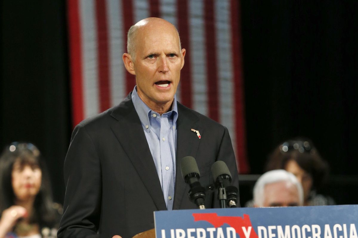 Florida Gov. Rick Scott, speaks to Cuban-American supporters at a campaign stop July 13, 2018, in Hialeah, Fla. (Wilfredo Lee / Associated Press)