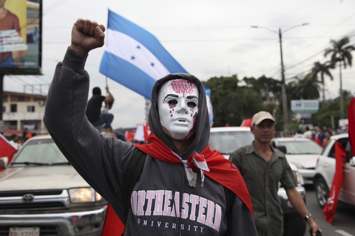 Opposition supporters protest in a march Saturday, Jan. 6, 2018, led by Salvador Nasralla, who reaffirmed his claim on the presidency, in the central park of San Pedro Sula, Honduras. Following a disputed election marred by irregularities, incumbent Juan Orlando Hernandez was declared the victor and will be inaugurated on Jan. 27. At a march and rally that drew thousands, Nasralla said he would not stop calling for protests and civil disobedience until Hernandez agrees to step down. (Fernando Antonio / Associated Press)