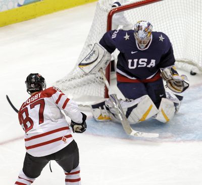 Canada's Sidney Crosby (87) shoots past USA goalie Ryan Miller (39) for the game-winning goal in the overtime period of a men's gold medal ice hockey game at the Vancouver 2010 Olympics in Vancouver, British Columbia, Sunday, Feb. 28, 2010. (Chris O'meara / Associated Press)