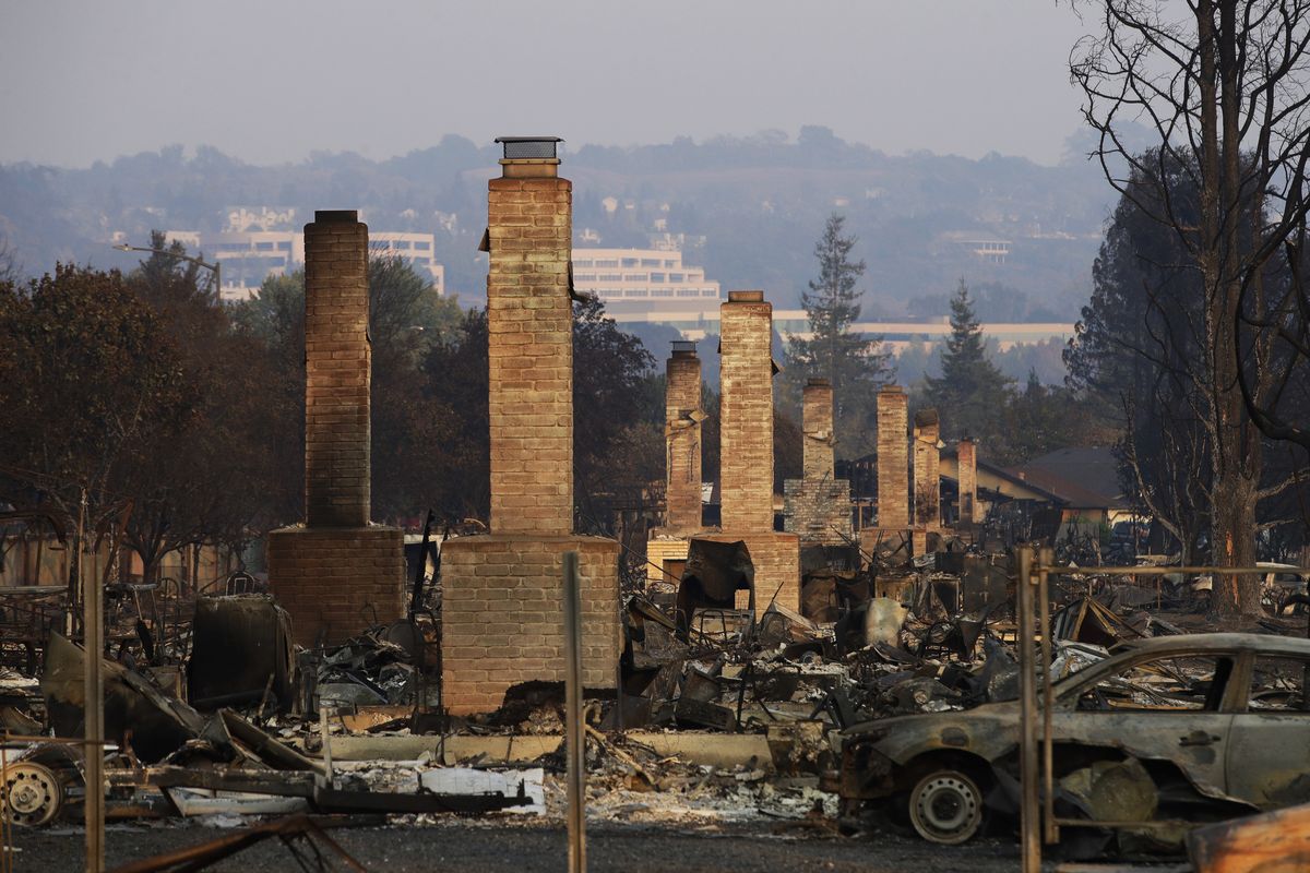 A row of chimneys stand in a neighborhood devastated by the 2017 Tubbs fire near Santa Rosa, Calif.  (Jae C. Hong)