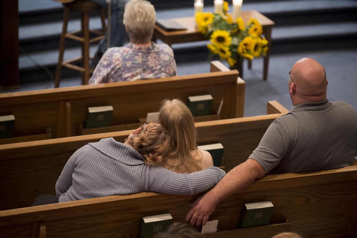 Parents hugged children during a service to remember the victims of the Freeman High School shooting Wednesday, Sept. 13, 2017 at Fairfield Community Church. Most of the kids in attendance attend Liberty High School or a Central Valley school. (Jesse Tinsley / The Spokesman-Review)