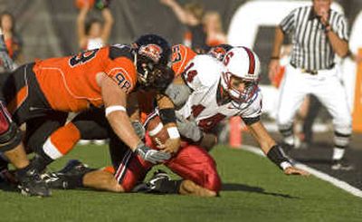 
Harassing quarterbacks is a big part of OSU's defensive success. Associated Press
 (Associated Press / The Spokesman-Review)
