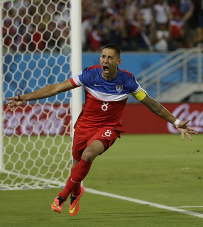 United States' Clint Dempsey celebrates after scoring the opening goal during the group G World Cup soccer match between Ghana and the United States at the Arena das Dunas in Natal, Brazil, Monday. The U.S. won, 2-1. (Associated Press)