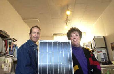 
Bruce Gage and his sister, Nadine Sullivan with a solar panel in their Spokane Valley store, Eco Depot.
 (The Spokesman-Review)