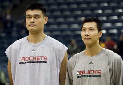 
Milwaukee Bucks' Yi Jianlian, right, poses with Houston Rockets' Yao Ming during warmups. Associated Press
 (Associated Press / The Spokesman-Review)