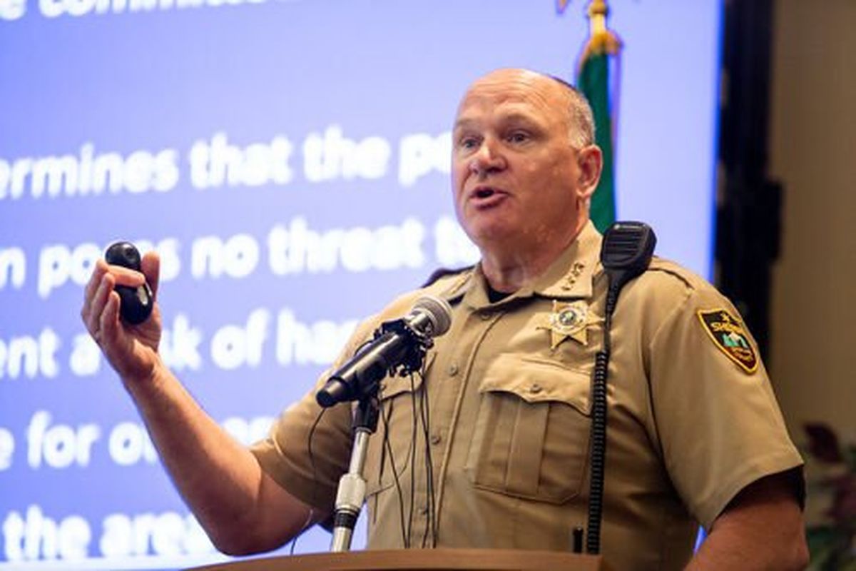 Spokane County Sheriff Ozzie Knezovich speaks during a press conference in Spokane Valley last summer.  (Libby Kamrowski/The Spokesman-Review)