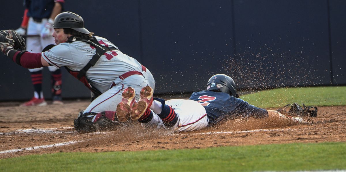 Gonzaga's Savier Pinales (2) is safe at home against Santa Clara's Cal Christofori (17) during the game in Spokane on Friday, May 13, 2022.  (kathy plonka)