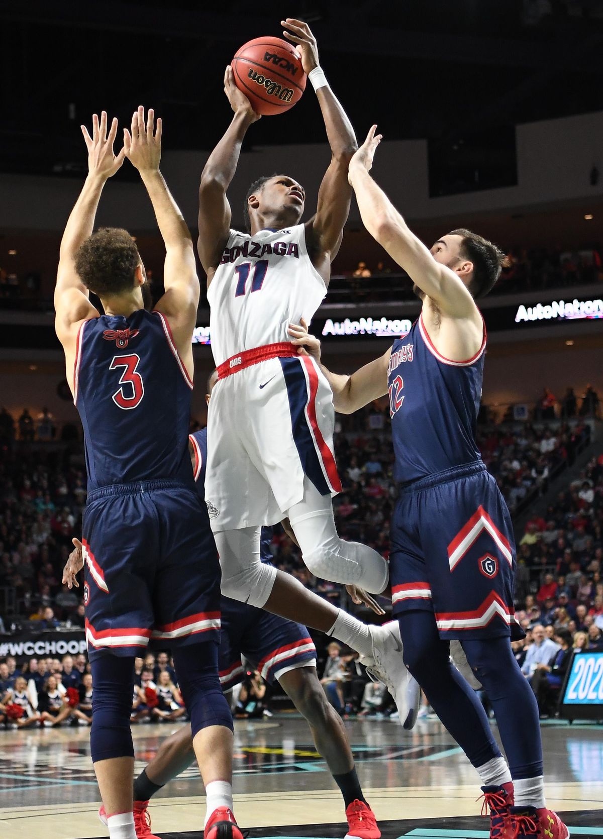 Gonzaga Bulldogs guard Joel Ayayi (11) drives to the hoop and shoots against Saint Mary