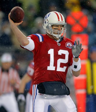 Patriots’ Tom Brady threw 5 TD passes in one quarter.  (Associated Press / The Spokesman-Review)