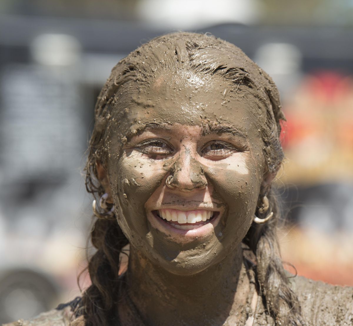 Haley Meacham, of Spokane, ends the Dirty Dash race with a face full of mud Saturday, July 8, 2017, at Riverside State Park. The popular foot race takes contestants through mud bogs and over obstacles. (Jesse Tinsley / The Spokesman-Review)