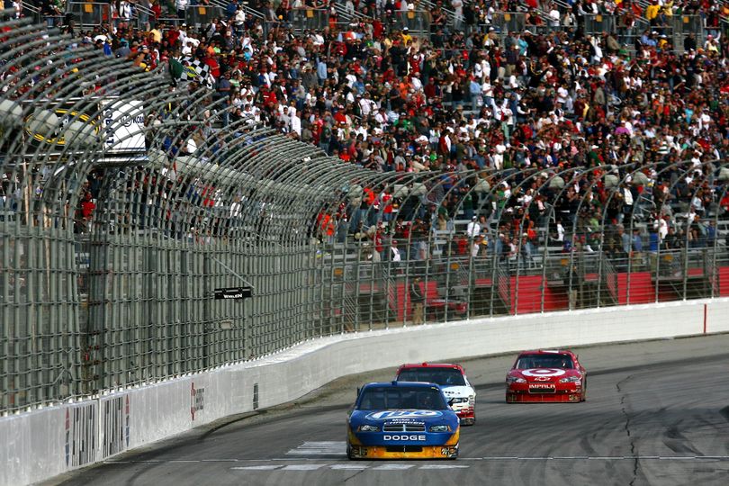 Kurt Busch, driver of the No. 2 Miller Lite Dodge, crosses the finish line ahead of Matt Kenseth and Juan Pablo Montoya to to take the checkered flag on Sunday at Atlanta Motor Speedway. (Photo courtesy of Getty Images/NASCAR)