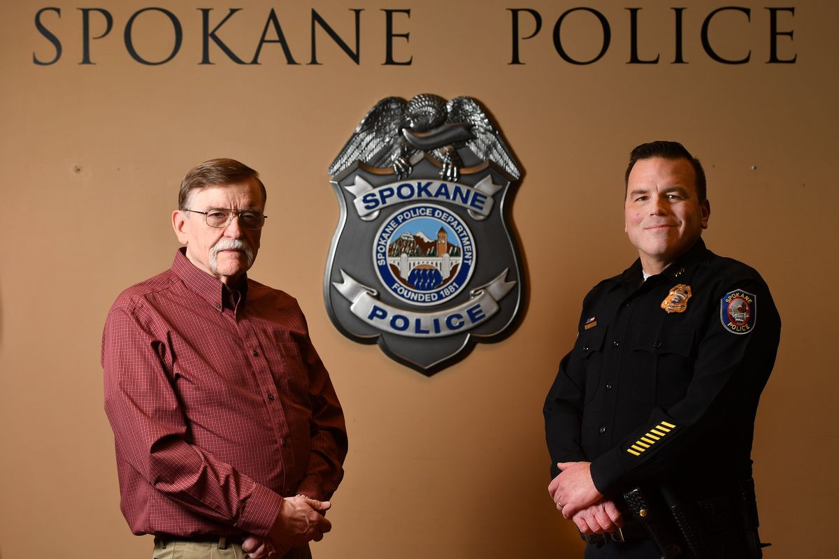 Spokane interim police Chief Justin Lundgren, right, poses for a photo at the Public Safety Building on Wednesday with his father, Jim Lundgren, who served as a detective for a large part of his 33-year career with the Spokane Police Department.  (Tyler Tjomsland/The Spokesman-Review)