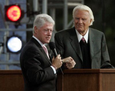 
Former president Bill Clinton, left, speaks alongside the Rev. Billy Graham during the Greater New York Billy Graham Crusade on Saturday. 
 (Associated Press / The Spokesman-Review)