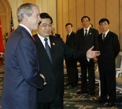 
U.S. President George W. Bush and Chinese President Hu Jintao meet on the sidelines of the Asia Pacific Economic Cooperation summit in Hanoi, Vietnam, today. 
 (Associated Press / The Spokesman-Review)
