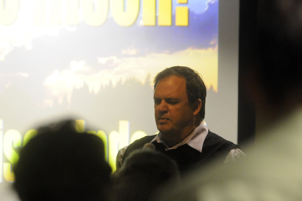 Steve Wilson prays at the conclusion of the weekly “Singspiration” at CenterPlace on Easter Sunday. He has joined fellow retired minister Ian Robertson to start ChangePoint. (J. BART RAYNIAK)
