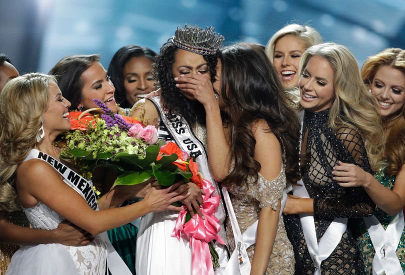 Miss District of Columbia USA Kara McCullough, center, reacts with fellow contestants after she was crowned the new Miss USA during the Miss USA contest Sunday, May 14, 2017, in Las Vegas. (AP Photo/John Locher) 
