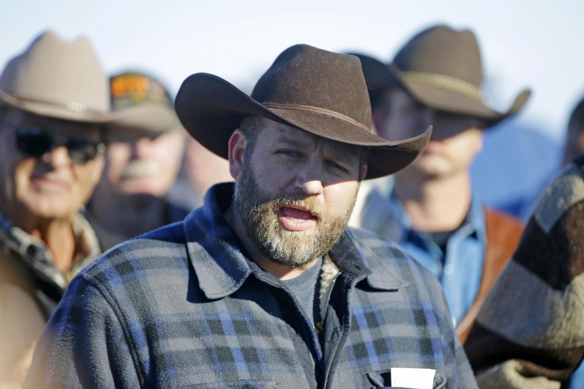 Ammon Bundy speaks with reporter at a news conference at Malheur National Wildlife Refuge Friday, Jan. 8, 2016, near Burns, Ore. Bundy, the leader of an armed group occupying the national wildlife refuge to protest federal land management policies said Friday he and his followers are not ready to leave even though the sheriff and many locals say the group has overstayed their welcome. (Rick Bowmer / Associated Press)