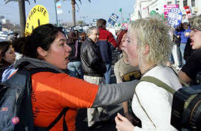 
An anti-abortion demonstrator, left, argues with abortion rights supporters in San Francisco on Saturday. 
 (Associated Press / The Spokesman-Review)