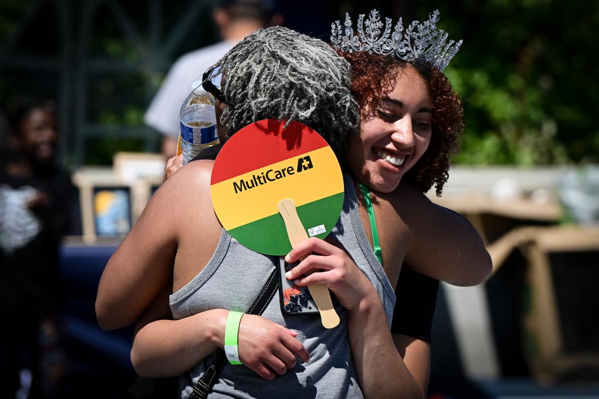 Mona Martin, left, congratulates Michaela Daou, Miss Juneteenth 2026, on her coronation Friday during a Juneteenth celebration at Riverfront Park in Spokane. (Tyler Tjomsland/The Spokesman-Review)