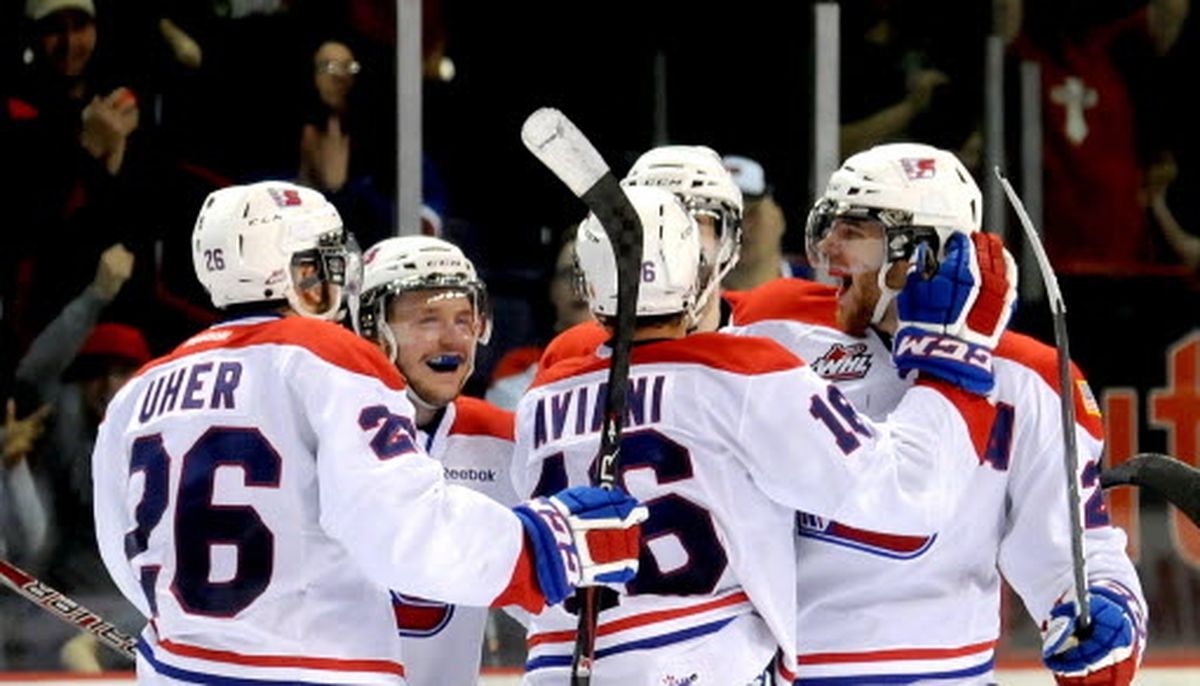 Spokane Chiefs, from left to right, Dominic Uher, Mitch Holmberg, Mike Aviani and Corbin Baldwin enjoy series-clinching victory. (Kathy Plonka)
