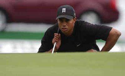 
Tiger Woods studies the 18th green during the Ford Championship at Doral on Thursday.
 (Associated Press / The Spokesman-Review)