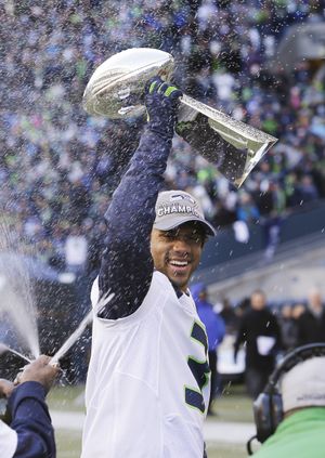 Russell Wilson hoisted the Lombardi after the Super Bowl and a magical trophy tour began. (Associated Press)