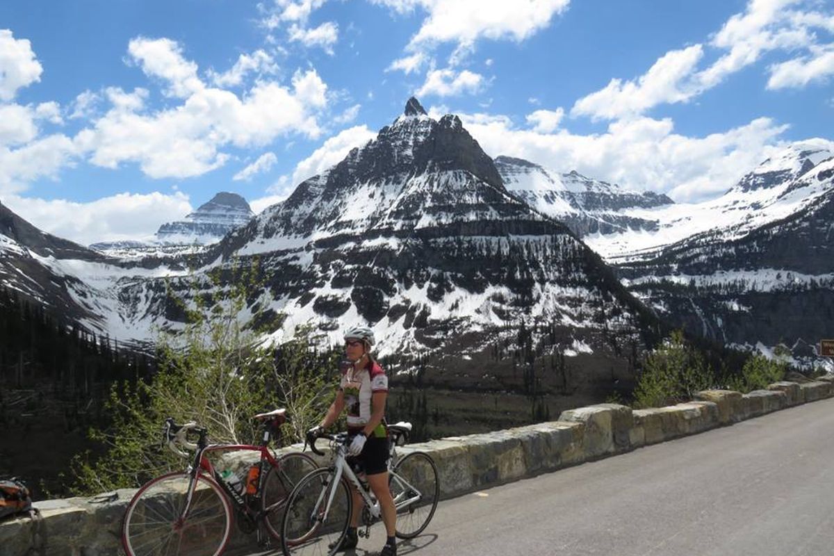 Arlene Cook pauses for the view while bicycling up Glacier National Park