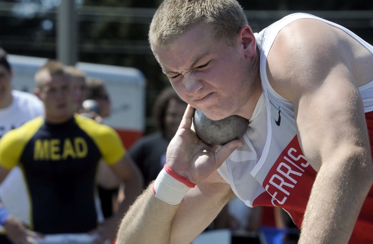 Boys 4A regional shot put winner Kjelby Oiland of Ferris prepares to uncork one of his attempts at Spokane Falls Community College. (Jesse Tinsley / The Spokesman-Review)