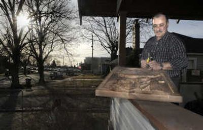 
Bassam Al Hayek works on one of his wood carvings on the front porch of his north Spokane  
 (CHRISTOPHER ANDERSON / The Spokesman-Review)
