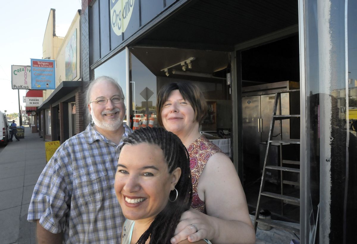 Denise Cerreta, front, has come to Spokane from Salt Lake City to mentor the  Raschkos as they build their community kitchen. (Christopher Anderson / The Spokesman-Review)