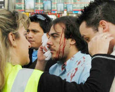 
Victims are attended by medical personnel, after a car bomb exploded Wednesday in Madrid. 
 (Associated Press / The Spokesman-Review)