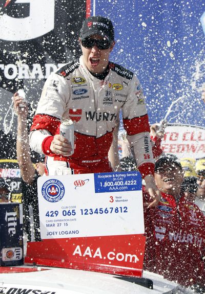 Brad Keselowski celebrates winning the Sprint Cup race at Fontana. (Associated Press)