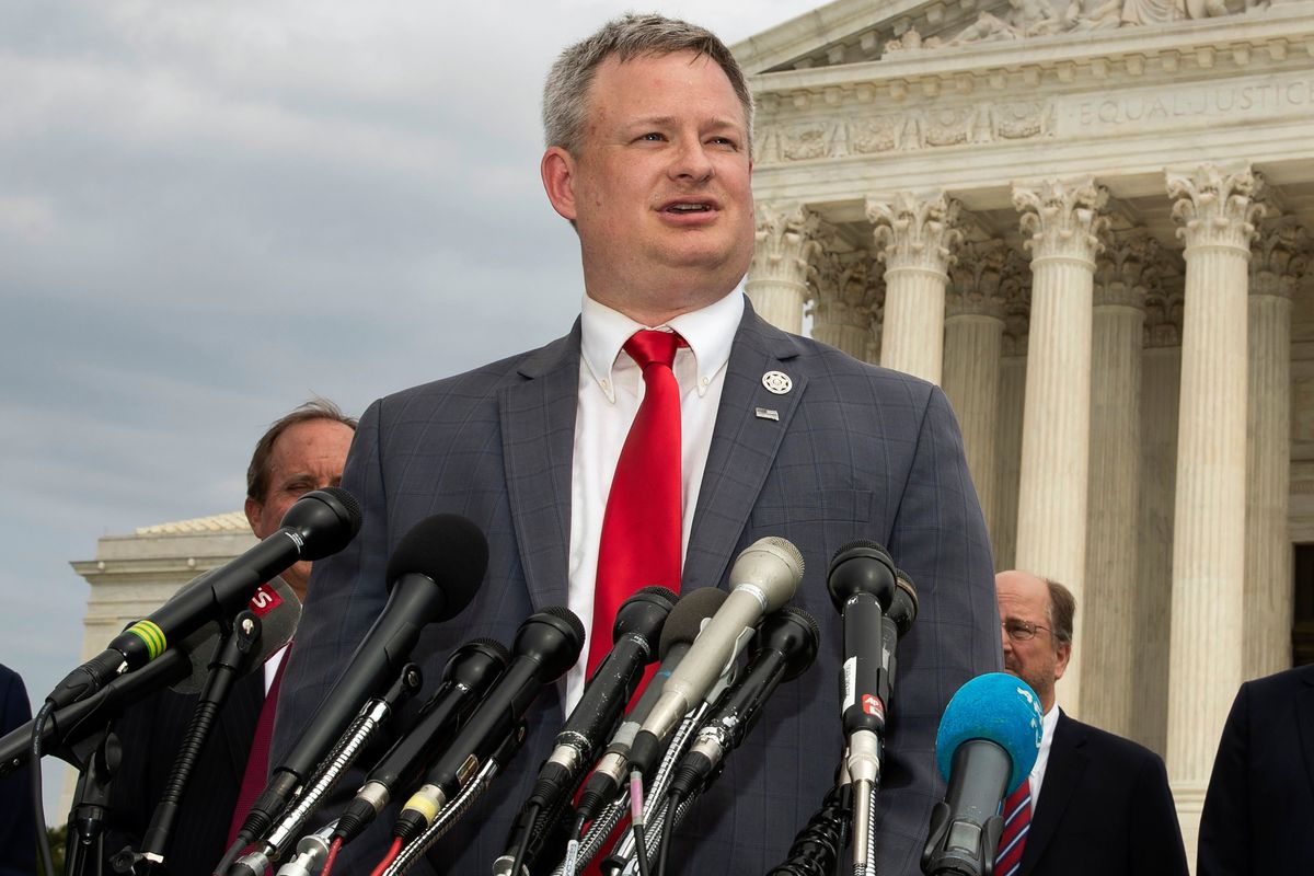 FILE - South Dakota Attorney General Jason Ravnsborg, joined by a bipartisan group of state attorneys general, speaks to reporters in front of the U.S. Supreme Court in Washington on Sept. 9, 2019. The South Dakota House is set to decide Tuesday, April 12, 2022, whether Ravnsborg should be impeached for his conduct before and after he struck and killed a pedestrian on the shoulder of a highway.  (Manuel Balce Ceneta)