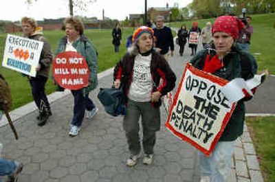 
Members of Connecticut Network to Abolish the Death Penalty march in Hartford on Sunday. The group plans to march every day on their way to a prison in Somers, where Friday's execution of convicted murderer Michael Ross is scheduled. 
 (Associated Press / The Spokesman-Review)
