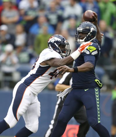 Broncos’ Shaquil Barrett pressures QB Tarvaris Jackson Friday. (Associated Press)