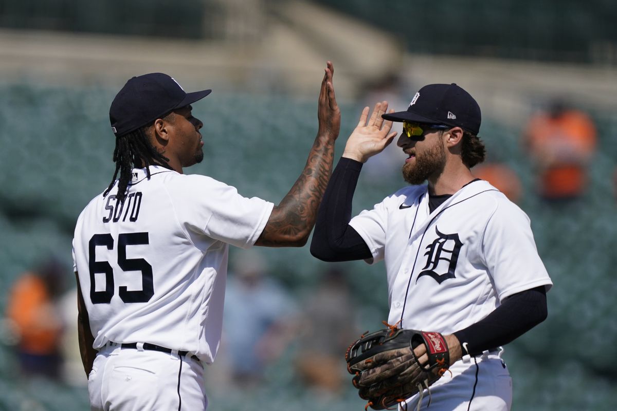Detroit Tigers relief pitcher Gregory Soto (65) greets left fielder Eric Haase after the team