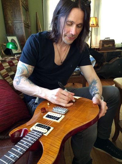 Homegrown rocker Myles Kennedy donated an autographed Paul Reed Smith electric guitar on behalf of Street Music Week for the upcoming Taking a Bite Out of Hunger auction that takes place at the Arena on May 20. (Doug Clark)