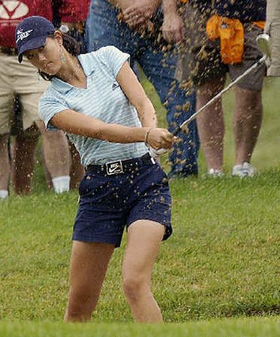 
Michelle Wie, hitting out a bunker, admits the Masters is in the back of her mind.
 (Associated Press / The Spokesman-Review)