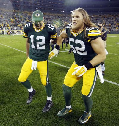 Quarterback Aaron Rodgers, left, and linebacker Clay Matthews celebrate Green Bay’s win over Kansas City on Monday night. (Associated Press)