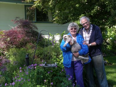 Jeanne and George Mackay, and their dog Oscar, in their garden. Special to  (PAT MUNTS Special to / The Spokesman-Review)
