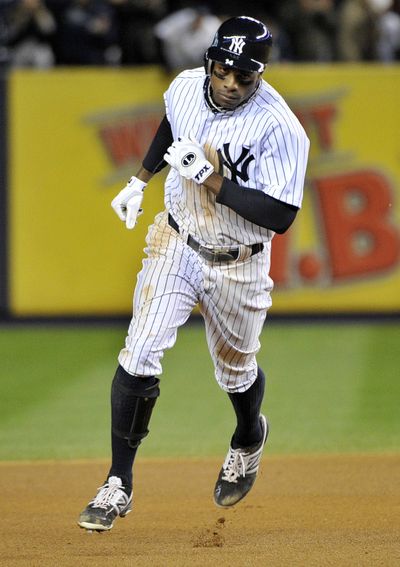 New York’s Curtis Granderson rounds the bases after hitting a solo homer in the seventh inning Friday. (Associated Press)