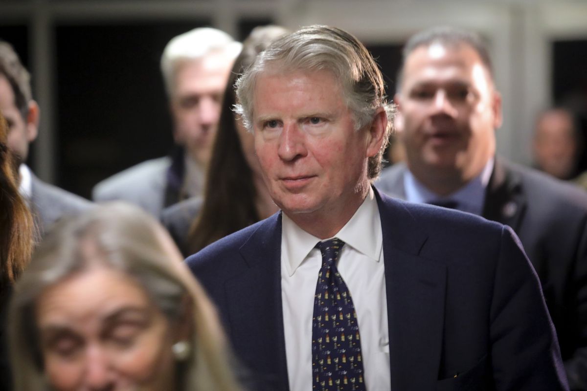 FILE - In this Friday Feb. 14, 2020, file photo, Manhattan District Attorney Cyrus Vance Jr., center, leaves Criminal Court in New York. New York prosecutors are asking new questions about former President Donald Trump